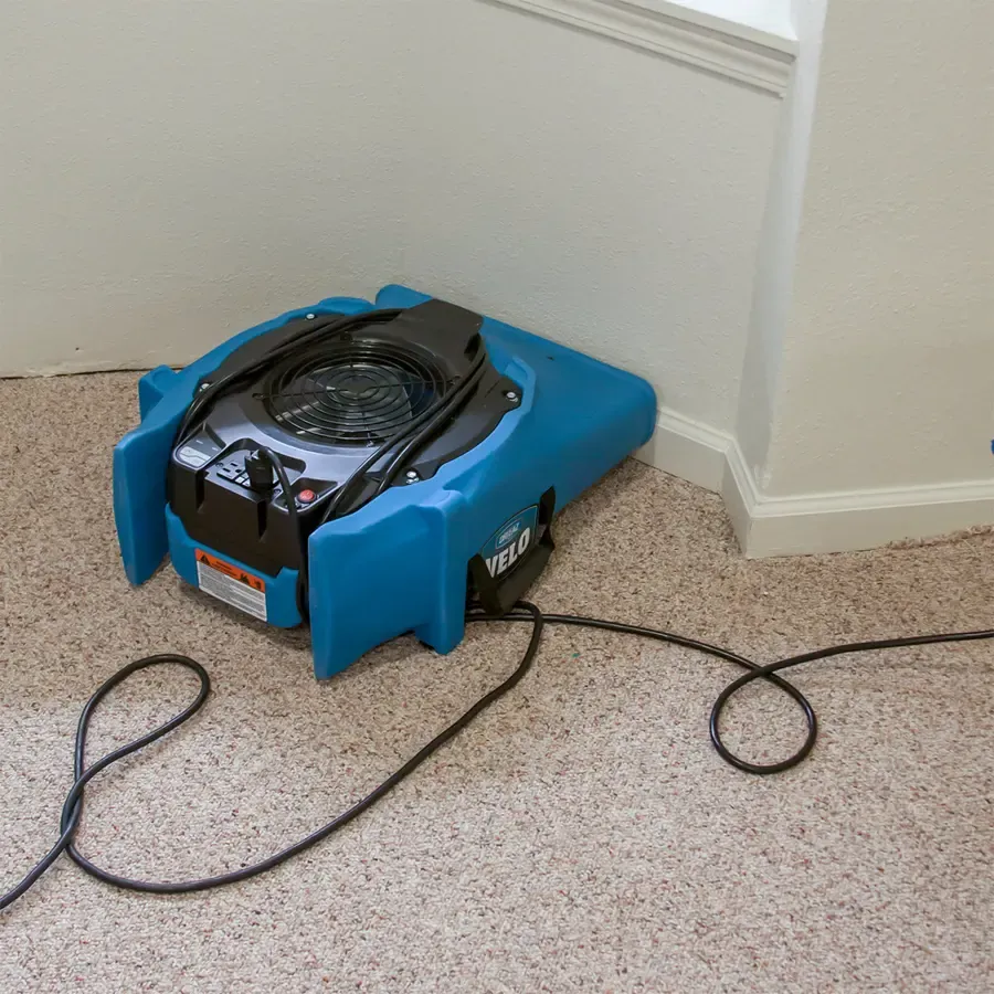 A dehumidifier running during a dry-out in Alpharetta, GA