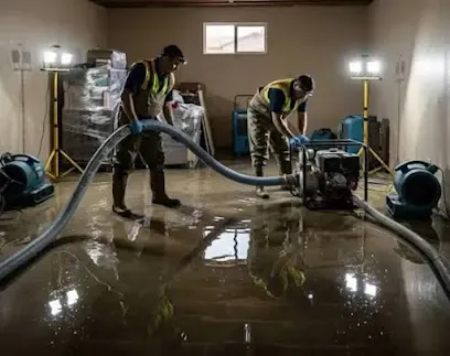 A technician extracting standing water from a floor in Alpharetta, GA